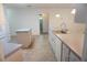 Spacious kitchen with island, updated cabinets, and stainless steel sink at 15037 Mcgraw Ave, Port Charlotte, FL 33953