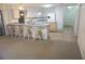 Bright eat-in kitchen featuring lots of counter space and an island for extra seating at 15037 Mcgraw Ave, Port Charlotte, FL 33953