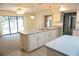 Open concept kitchen with stainless steel appliances and sliding glass door access to the pool at 15037 Mcgraw Ave, Port Charlotte, FL 33953