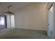 Spacious living room featuring a ceiling fan, neutral paint, and an open layout at 15037 Mcgraw Ave, Port Charlotte, FL 33953