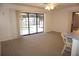 Open living room with large sliding glass doors that overlook the pool area at 15037 Mcgraw Ave, Port Charlotte, FL 33953