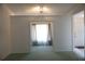 Bright and open living room space with large opening into another room at 15037 Mcgraw Ave, Port Charlotte, FL 33953