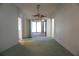 Open living room space with a view to a screen patio and view of the back yard at 15037 Mcgraw Ave, Port Charlotte, FL 33953