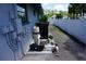 Image features pool equipment, including a filter and heater, situated next to the home's exterior wall at 15037 Mcgraw Ave, Port Charlotte, FL 33953