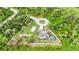 Aerial image showing the house with a fenced in yard, a fire pit, and a pool with a screen at 1546 Gourmet Rd, North Port, FL 34288
