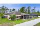 View of the backyard with the pool enclosed, the screened in porch, and the fenced in yard at 1546 Gourmet Rd, North Port, FL 34288