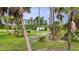 Expansive, tree-filled backyard offering natural beauty and privacy with lush greenery at 1546 Gourmet Rd, North Port, FL 34288