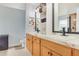 Bathroom featuring a double vanity with marble countertops and modern fixtures at 1546 Gourmet Rd, North Port, FL 34288