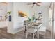 Bright dining area with wood-look floors and modern decor at 1546 Gourmet Rd, North Port, FL 34288