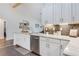 Kitchen with white cabinets and stainless steel appliances at 1546 Gourmet Rd, North Port, FL 34288