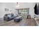 Comfortable living room with hardwood floors, neutral decor, and an open concept layout at 1546 Gourmet Rd, North Port, FL 34288