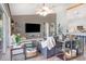 Bright living room with neutral décor, comfortable seating, and open access to the kitchen at 1546 Gourmet Rd, North Port, FL 34288