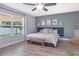 Serene main bedroom with a large window and neutral color scheme at 1546 Gourmet Rd, North Port, FL 34288