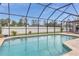 Refreshing pool with screened enclosure, offering privacy and a great space for entertaining at 1546 Gourmet Rd, North Port, FL 34288