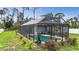 Areal shot shows a beautiful pool with screened enclosure, providing a private backyard oasis at 1546 Gourmet Rd, North Port, FL 34288