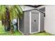 Backyard features a small shed, greenery, and natural light to add appeal at 1546 Gourmet Rd, North Port, FL 34288