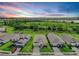 Aerial view of a well-planned neighborhood with lush greenery and community lake at 16336 Preservation Blvd, Punta Gorda, FL 33982
