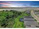Aerial view of a waterfront community and a lake during sunset at 16336 Preservation Blvd, Punta Gorda, FL 33982