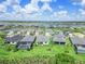 Aerial view of a community with a lake featuring manicured lawns and screened in pools at 16336 Preservation Blvd, Punta Gorda, FL 33982