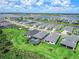 An aerial view of a lakeside community showcasing modern homes with lush green lawns and community waterways at 16336 Preservation Blvd, Punta Gorda, FL 33982