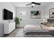 Inviting bedroom with a comfortable bed, stylish dresser, and relaxing decor, a tranquil retreat at 16336 Preservation Blvd, Punta Gorda, FL 33982