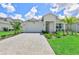 Beautiful home with a well manicured lawn and paver driveway at 16336 Preservation Blvd, Punta Gorda, FL 33982