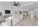 Open-concept living room with modern decor and hardwood floors at 16336 Preservation Blvd, Punta Gorda, FL 33982