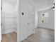 A pantry with ample shelving is seen in this image that provides a clear view into the adjacent bedroom space at 16336 Preservation Blvd, Punta Gorda, FL 33982