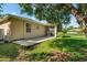 Spacious backyard with a patio and screen enclosed porch at 1693 Jagust Rd, North Port, FL 34288