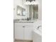 Bright bathroom features a granite vanity and soaking tub at 1693 Jagust Rd, North Port, FL 34288