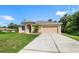 Lovely one-story home featuring a two-car garage and a well-kept lawn in a serene neighborhood at 1693 Jagust Rd, North Port, FL 34288
