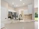 Kitchen with stainless steel appliances, tile backsplash, and island with countertop at 1693 Jagust Rd, North Port, FL 34288