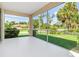 Screened porch with views of the backyard and surrounding neighborhood at 1693 Jagust Rd, North Port, FL 34288