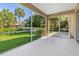 Screened porch with backyard views and lush, green landscaping at 1693 Jagust Rd, North Port, FL 34288