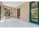 Screened porch with a green door provides views to the backyard at 1693 Jagust Rd, North Port, FL 34288