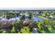 Lush aerial view of a waterfront home with a well-maintained lawn and mature trees at 17188 Cape Horn Blvd, Punta Gorda, FL 33955