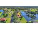 Beautiful aerial shot of a home nestled by a serene lake in a picturesque residential area at 17188 Cape Horn Blvd, Punta Gorda, FL 33955