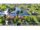 Beautiful aerial shot of waterfront homes with tile roofs along a serene lake at 17188 Cape Horn Blvd, Punta Gorda, FL 33955