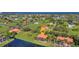 Expansive aerial view of a community with waterfront homes and lush green spaces at 17188 Cape Horn Blvd, Punta Gorda, FL 33955