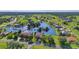 Panoramic aerial of a lakefront community with homes surrounded by greenery at 17188 Cape Horn Blvd, Punta Gorda, FL 33955