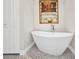 This bright bathroom features a modern bathtub and natural light at 17188 Cape Horn Blvd, Punta Gorda, FL 33955