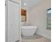 This bright bathroom features a large bathtub and lots of natural light at 17188 Cape Horn Blvd, Punta Gorda, FL 33955