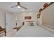 Inviting bedroom with white tile flooring, bright light, and ceiling fan at 17188 Cape Horn Blvd, Punta Gorda, FL 33955