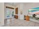 Open-concept foyer featuring tile floors, an art niche, and glass doors leading to the outside at 17188 Cape Horn Blvd, Punta Gorda, FL 33955