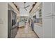 Modern kitchen with tile floors, stainless steel refrigerator, and white cabinets at 17188 Cape Horn Blvd, Punta Gorda, FL 33955