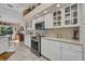 Bright kitchen features white cabinets, stainless oven, and quartz countertops at 17188 Cape Horn Blvd, Punta Gorda, FL 33955