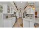 Spacious kitchen boasts white cabinets, tile floors, and stainless steel appliances at 17188 Cape Horn Blvd, Punta Gorda, FL 33955