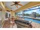 Relaxing lanai with lake views, comfortable seating, and outdoor dining set at 17188 Cape Horn Blvd, Punta Gorda, FL 33955