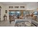 Inviting living area with an open floor plan, views of the lanai, and modern furniture at 17188 Cape Horn Blvd, Punta Gorda, FL 33955