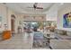 Spacious living room with tile floors, comfortable seating, and sliding glass doors at 17188 Cape Horn Blvd, Punta Gorda, FL 33955